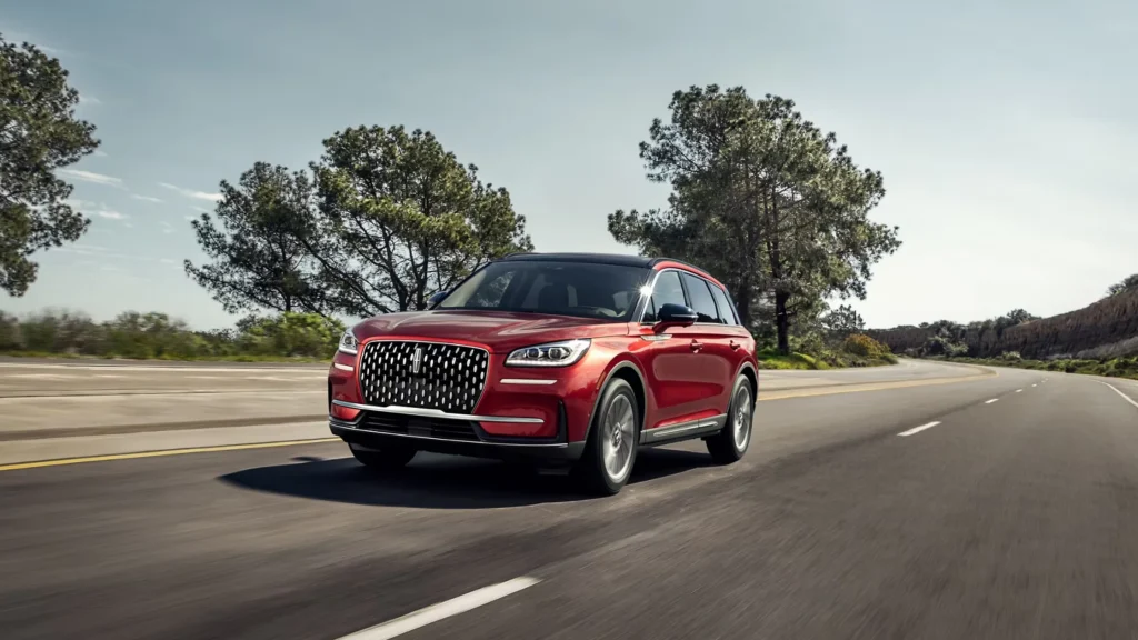 Side profile of 2025 Lincoln Corsair Reserve in motion with sculpted body and chrome trim.