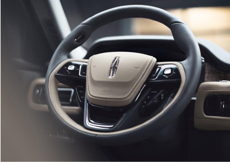 The intuitively placed controls of the steering wheel on a 2023 Lincoln Aviator® SUV | Nick Mayer Lincoln Westlake in Westlake OH