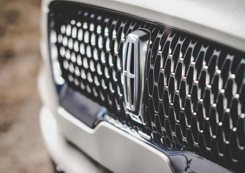 The grille of the 2024 Lincoln Aviator® Reserve model with an eye-catching repeated field of Lincoln Star logo shapes | Nick Mayer Lincoln Westlake in Westlake OH