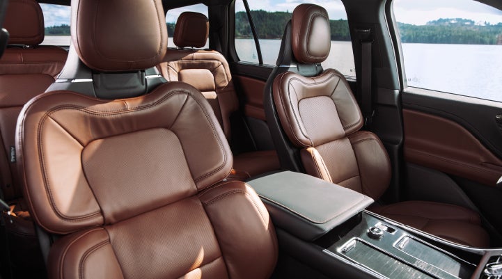 The front row's Perfect Position Seats in a 2024 Lincoln Aviator® Reserve model with Ebony Roast interior | Nick Mayer Lincoln Westlake in Westlake OH