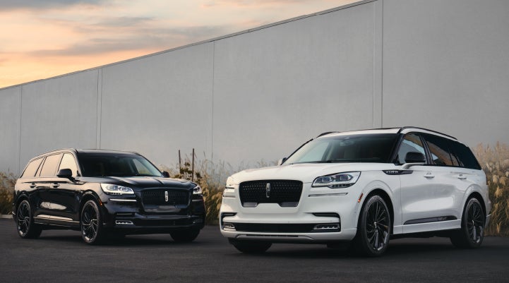 Two Lincoln Aviator® SUVs are shown with the available Jet Appearance Package | Nick Mayer Lincoln Westlake in Westlake OH