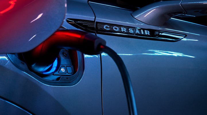 A charger plugged into the charging port of a 2024 Lincoln Corsair® Plug-in Hybrid model. | Nick Mayer Lincoln Westlake in Westlake OH