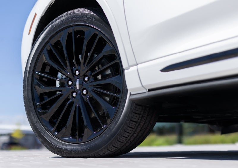 A stylish 20-inch black aluminum wheel of the available Jet Appearance Package is shown. | Nick Mayer Lincoln Westlake in Westlake OH