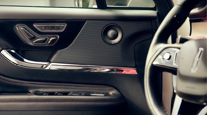 A Revel® audio speaker is shown in the driver's side door of a 2025 Lincoln Corsair® SUV. | Nick Mayer Lincoln Westlake in Westlake OH