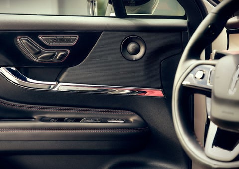 The driver of a 2024 Lincoln Corsair® SUV is shown selecting the drive mode. | Nick Mayer Lincoln Westlake in Westlake OH