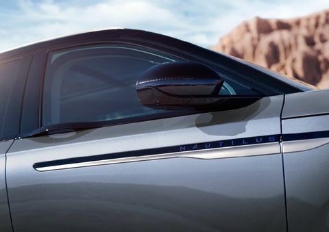 Blue lettering on the side of the vehicle that reads nautilus indicates the available hybrid powertrain. | Nick Mayer Lincoln Westlake in Westlake OH