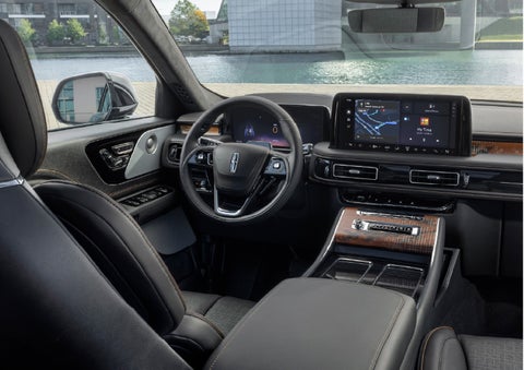 The interior of the 2026 Lincoln Aviator® SUV is shown parked with a view of a harbor through the windshield. | Nick Mayer Lincoln Westlake in Westlake OH
