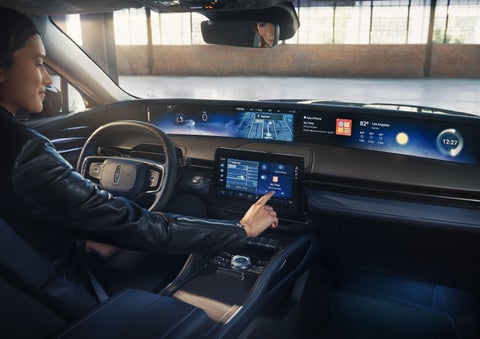The driver of a 2026 Lincoln Nautilus® SUV interacts with the center touchscreen. | Nick Mayer Lincoln Westlake in Westlake OH