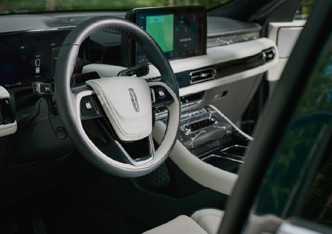 The leather-trimmed steering wheel of a 2027 Lincoln Aviator® Black Label™ SUV. | Nick Mayer Lincoln Westlake in Westlake OH