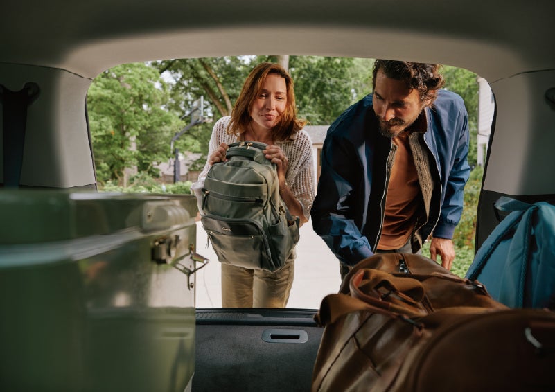 A couple loads luggage into the rear of a 2027 Lincoln Aviator® Black Label™ SUV..e 202 | Nick Mayer Lincoln Westlake in Westlake OH