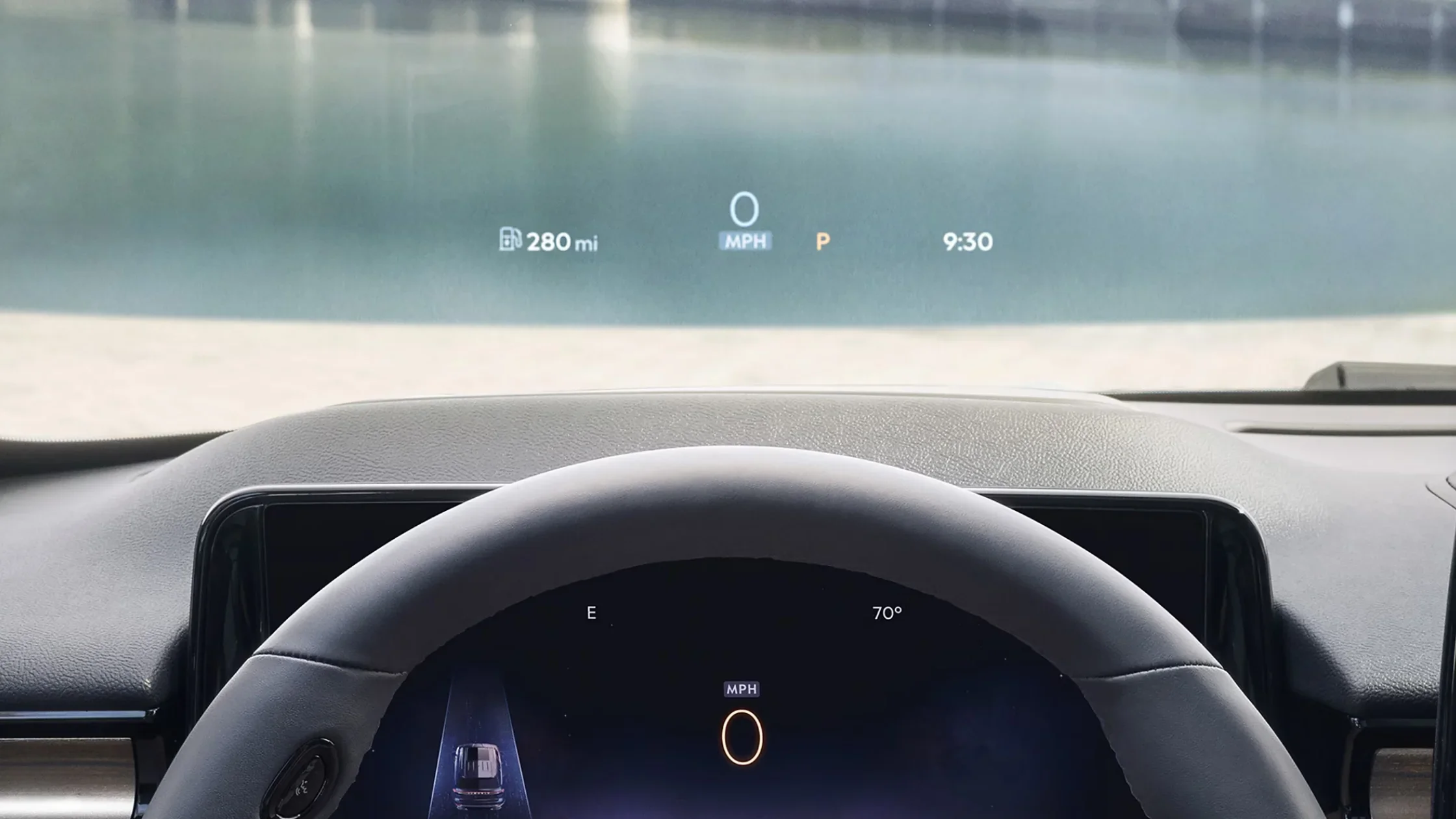 Driver’s view of the 2025 Lincoln Aviator® Reserve’s head-up display projected onto the windshield, showing speed, fuel range, and temperature.