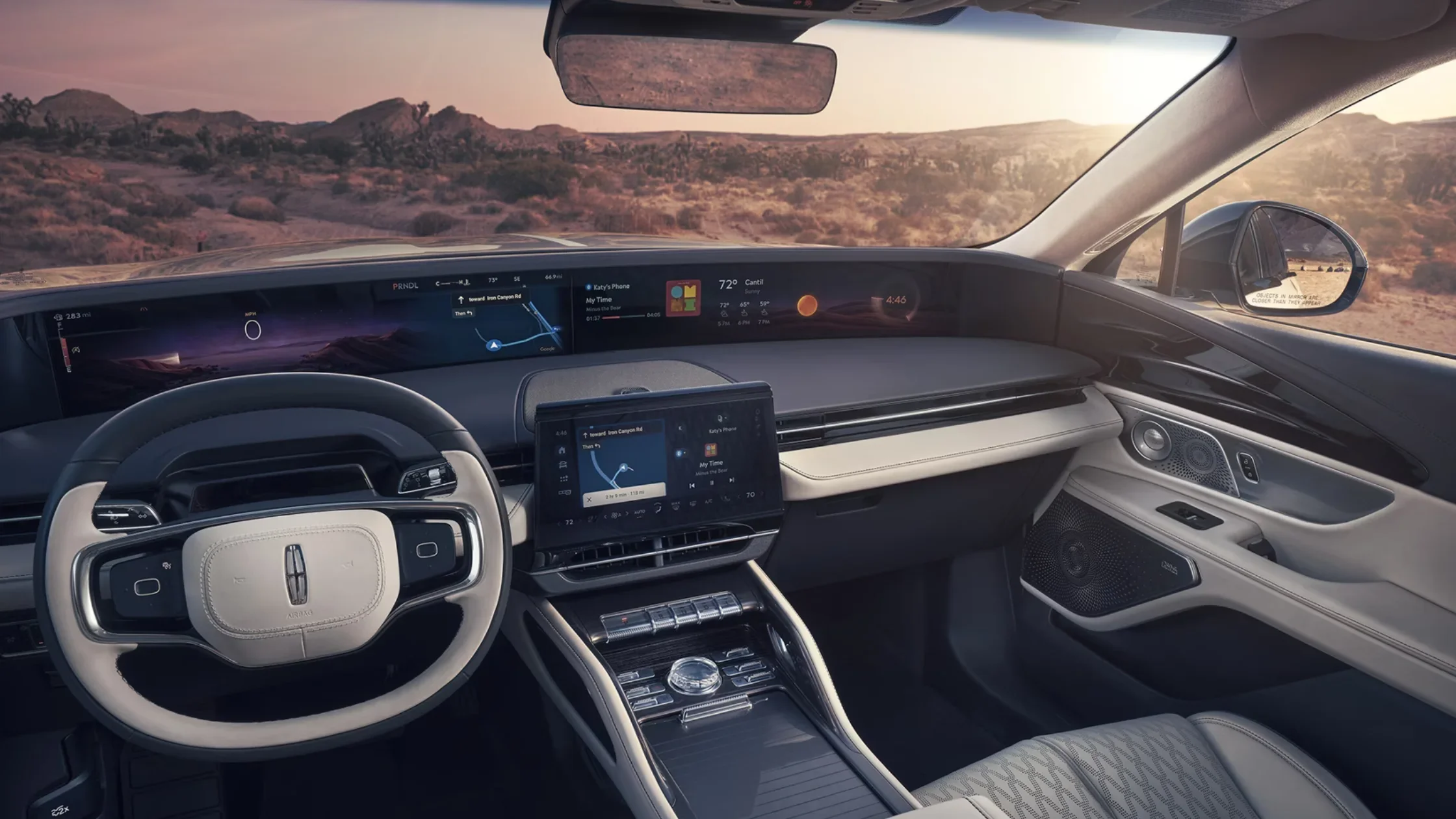 Interior dashboard view of the 2025 Lincoln Black Label Nautilus® featuring a wide digital display, steering wheel with Lincoln logo, and ambient lighting.