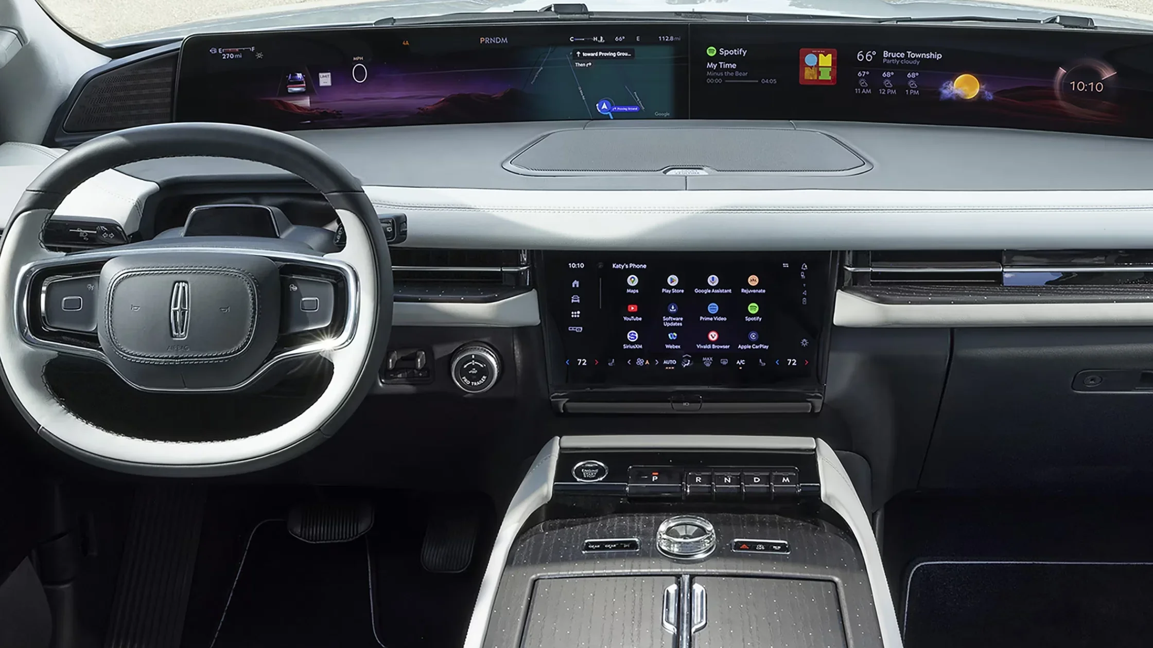 Interior view of the 2025 Lincoln Black Label Navigator® dashboard, featuring a wide digital display, touchscreen with app icons, and a premium leather-wrapped steering wheel.