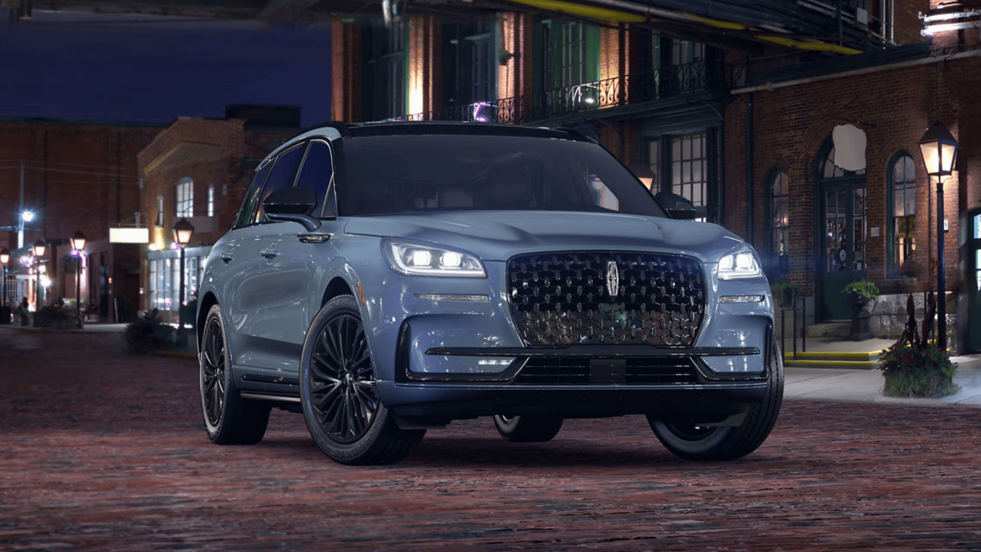 2025 Lincoln Corsair® Grand Touring front exterior driving view showing signature grille and LED headlights.