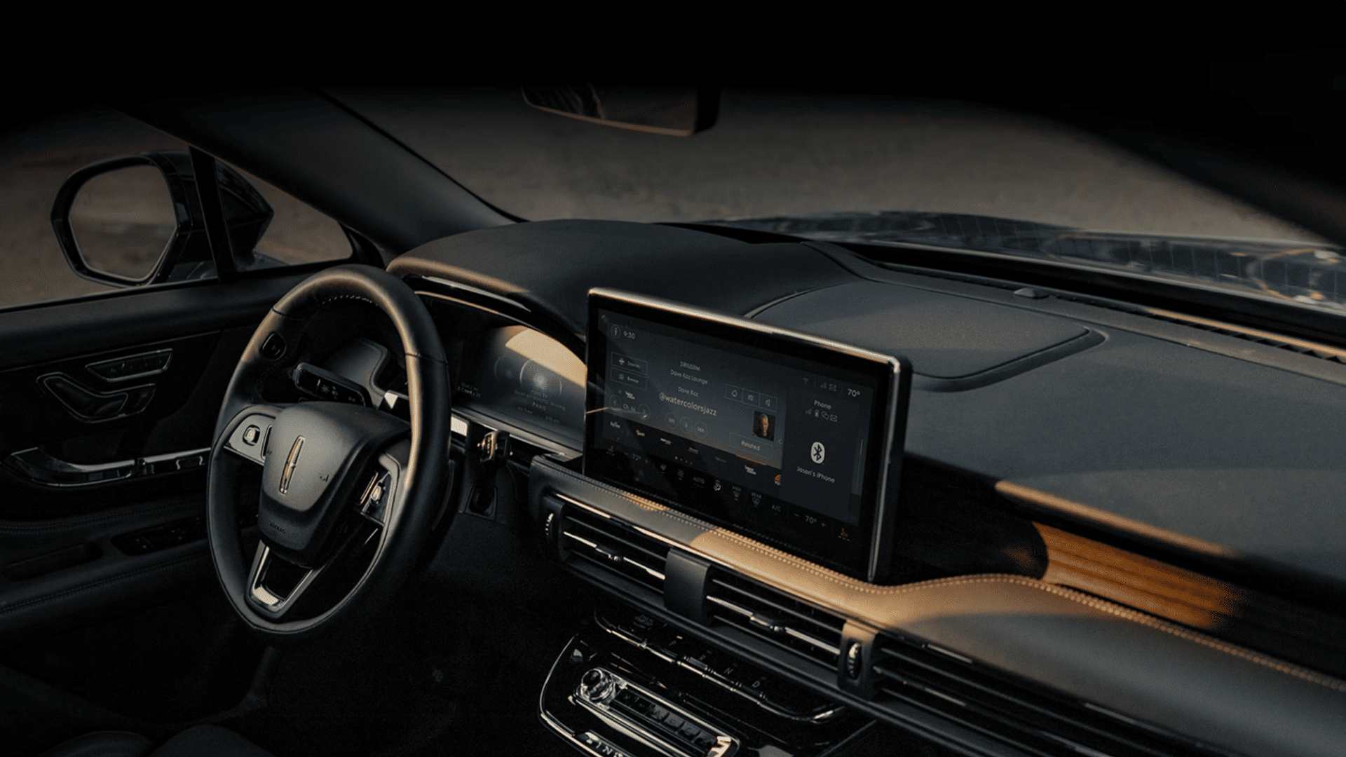 2025 Lincoln Corsair® Grand Touring luxury interior with panoramic display and brown leather seating.