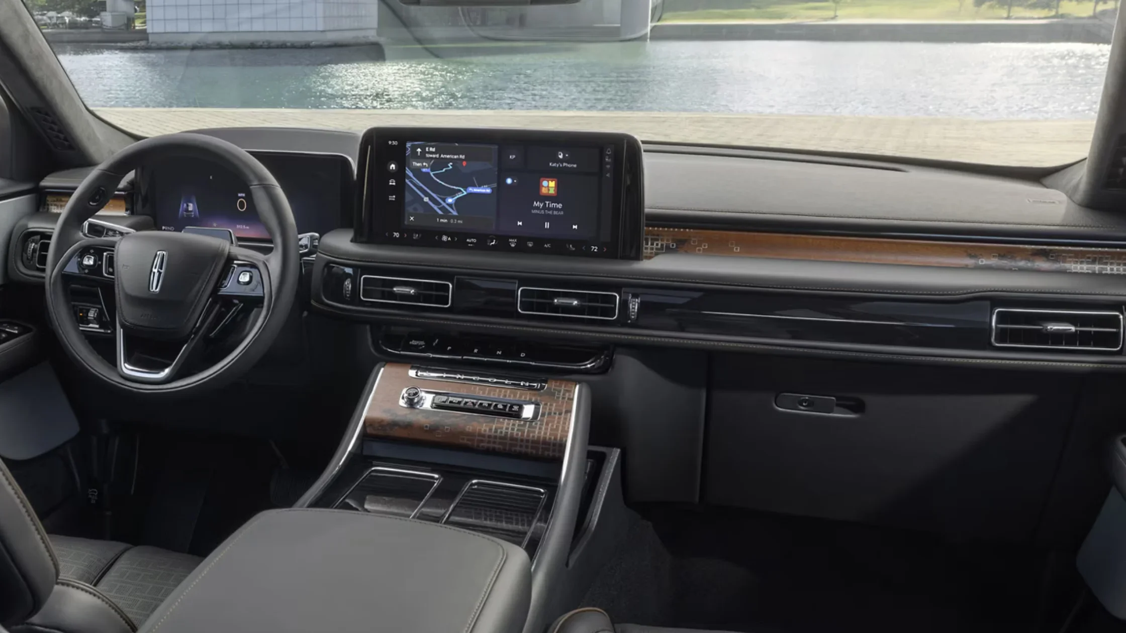 Luxurious interior dashboard of the 2025 Black Label Aviator® with digital displays and wood accents.