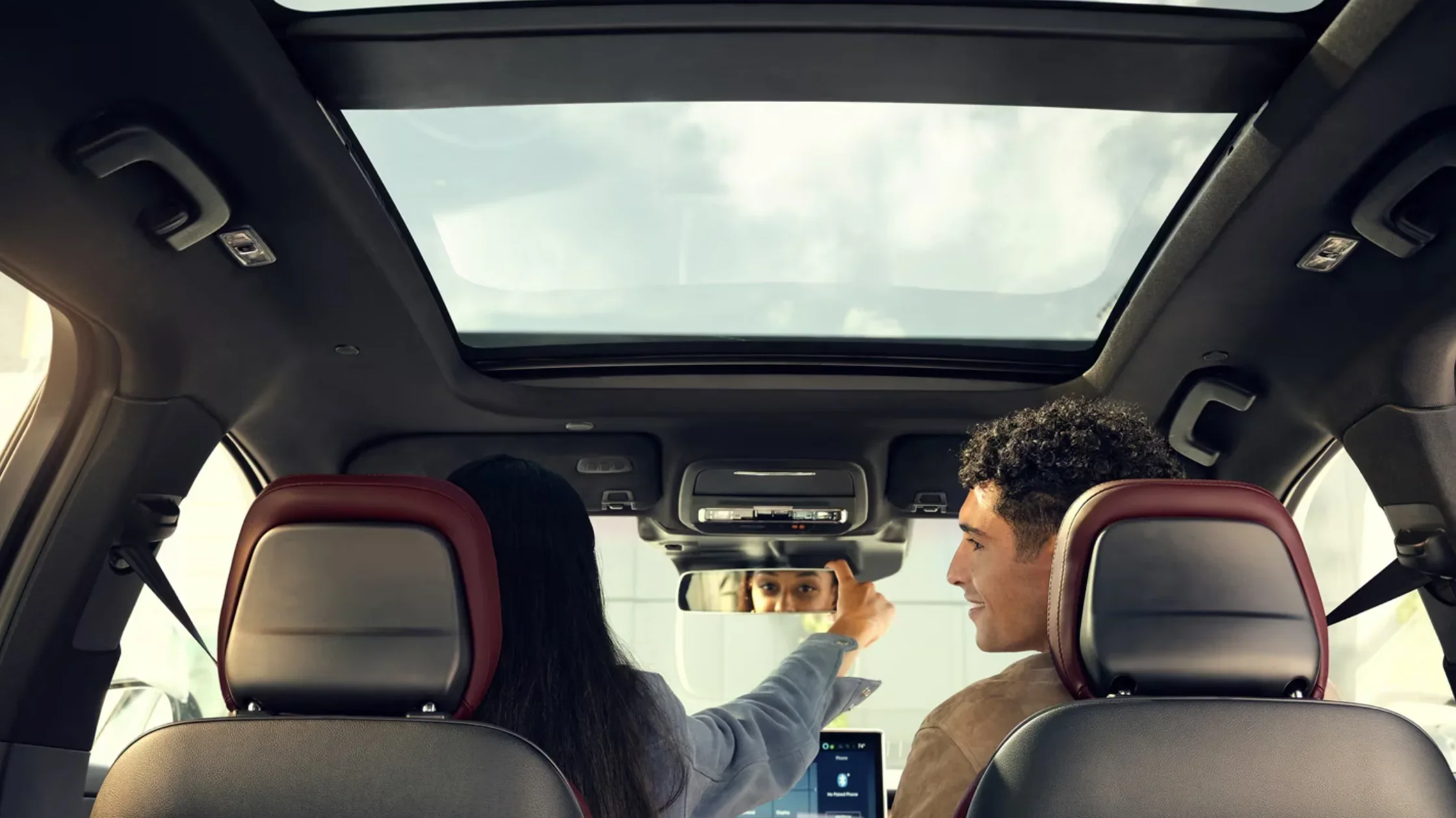 Panoramic view of the 2025 Lincoln Corsair® Grand Touring interior with dual moonroof and premium seating.