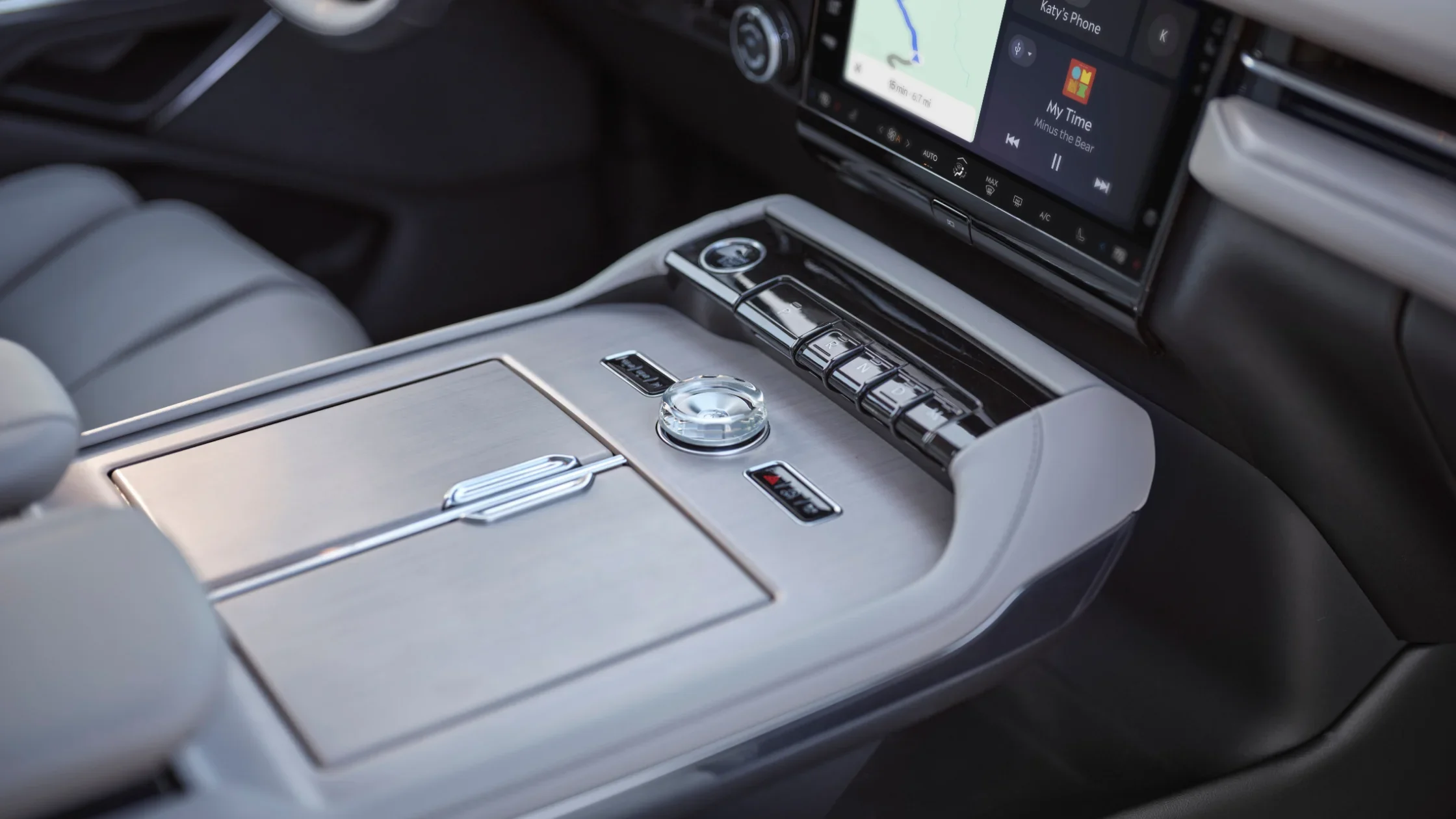 Sleek center console of the 2025 Lincoln Navigator® Reserve with a modern gear selector and premium finishes.