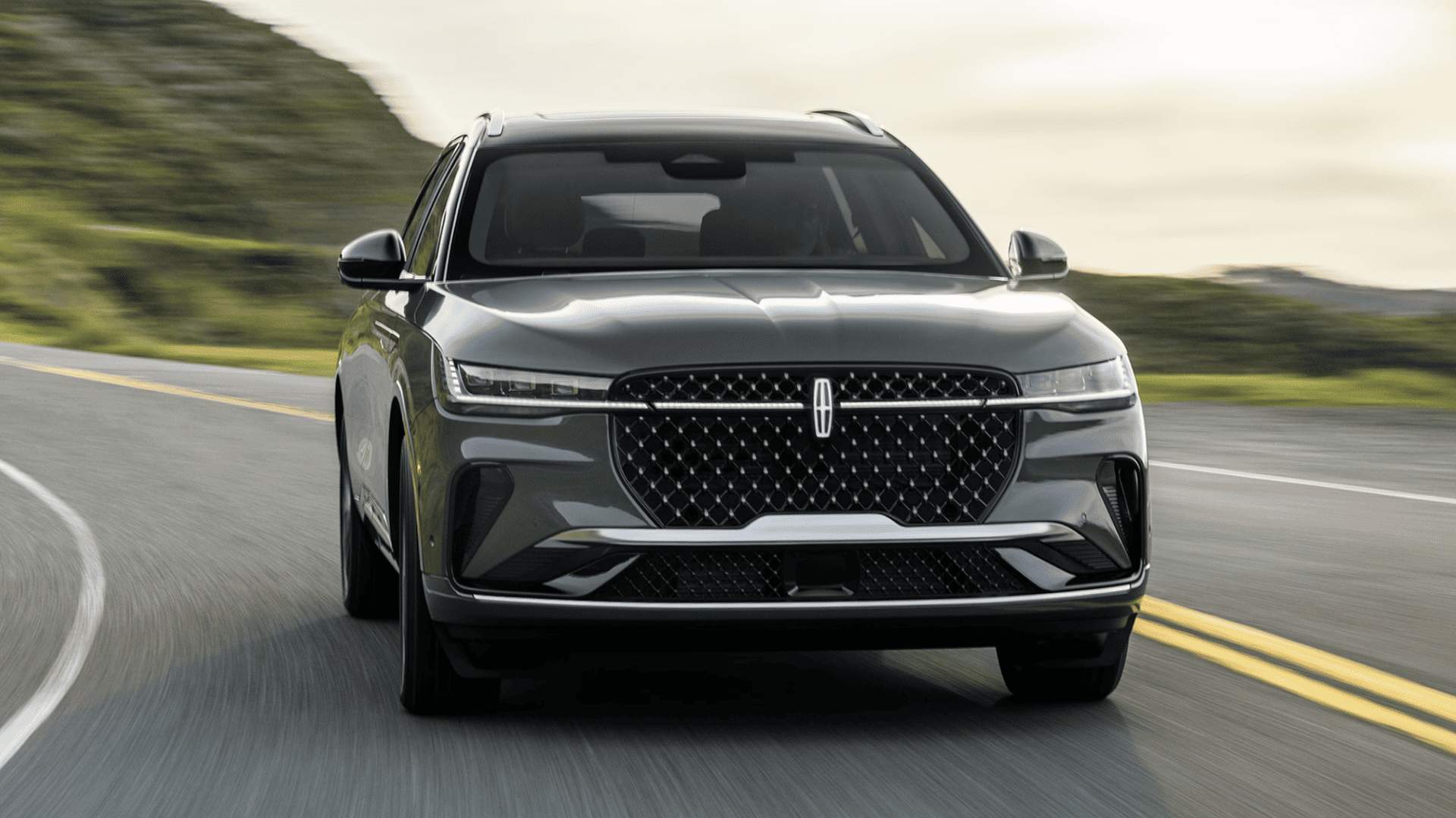 2025 Lincoln Nautilus® Black Label front driving view highlighting signature grille and LED headlights.