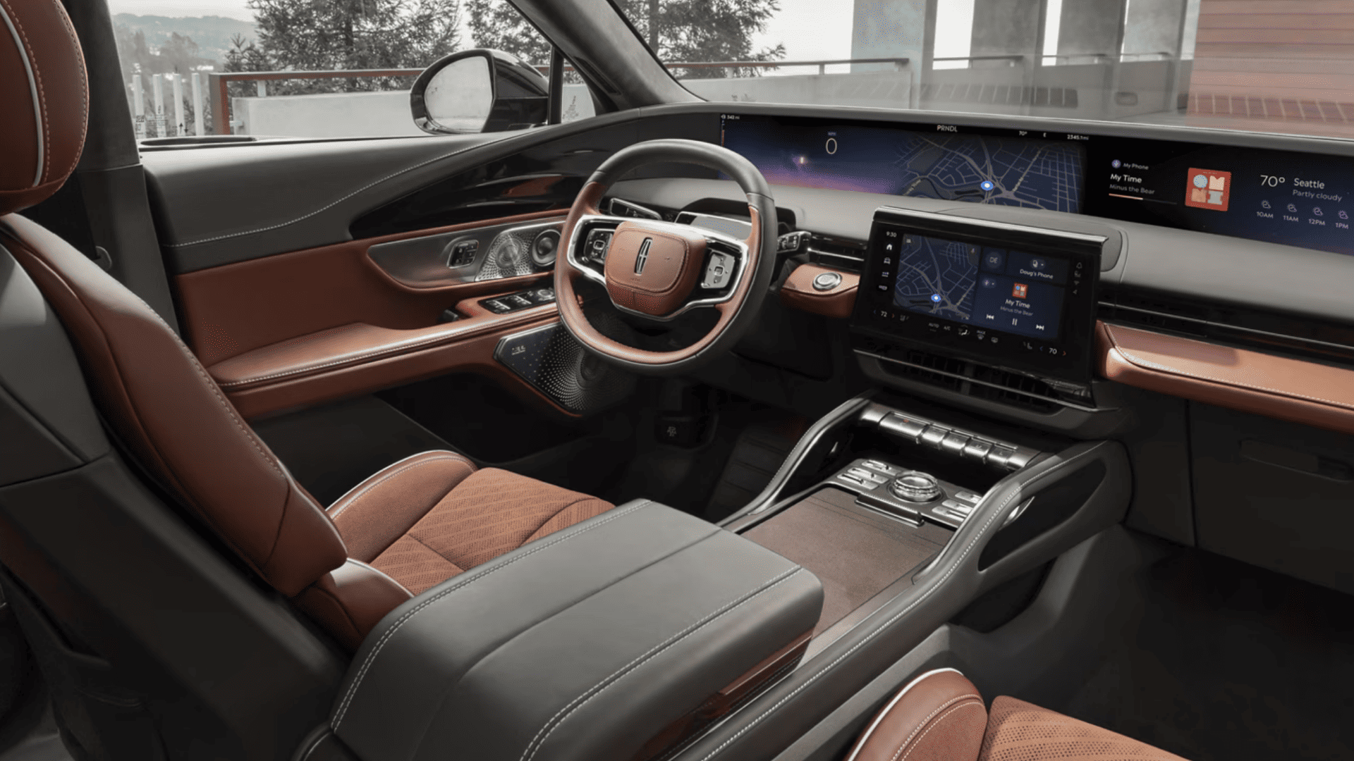 2025 Lincoln Nautilus® Black Label luxury interior cockpit with brown leather, digital display, and wood trim.