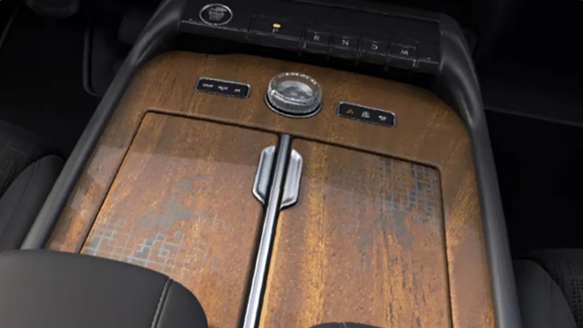 Close-up of the 2025 Black Label Navigator® center console featuring its signature wood finish, rotary gear selector, and premium craftsmanship.