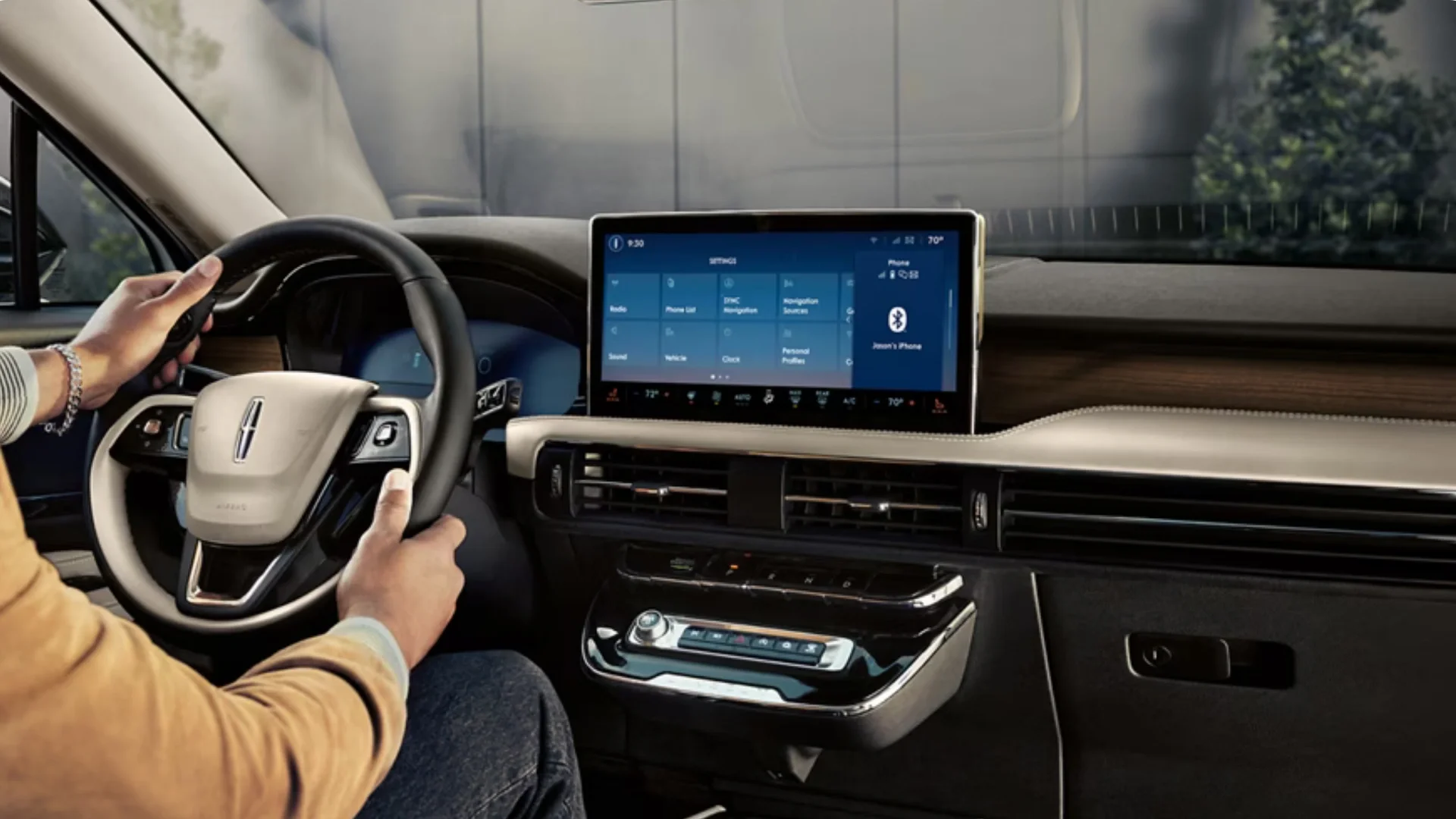 Interior view of the 2025 Corsair® Reserve highlighting the touchscreen display, steering wheel, and premium dashboard design.