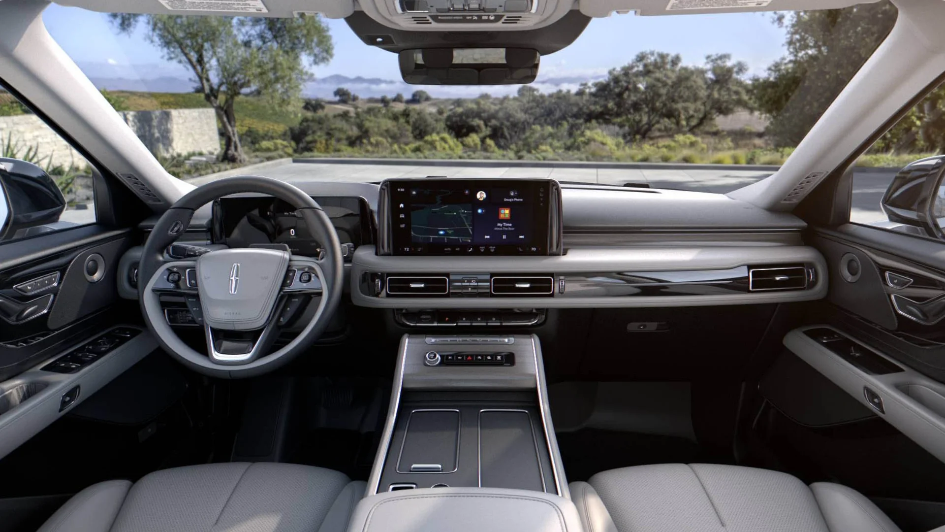 Cockpit of the 2025 Lincoln Black Label Aviator® featuring a sleek dashboard, digital displays, and leather-trimmed controls for a refined driving experience.