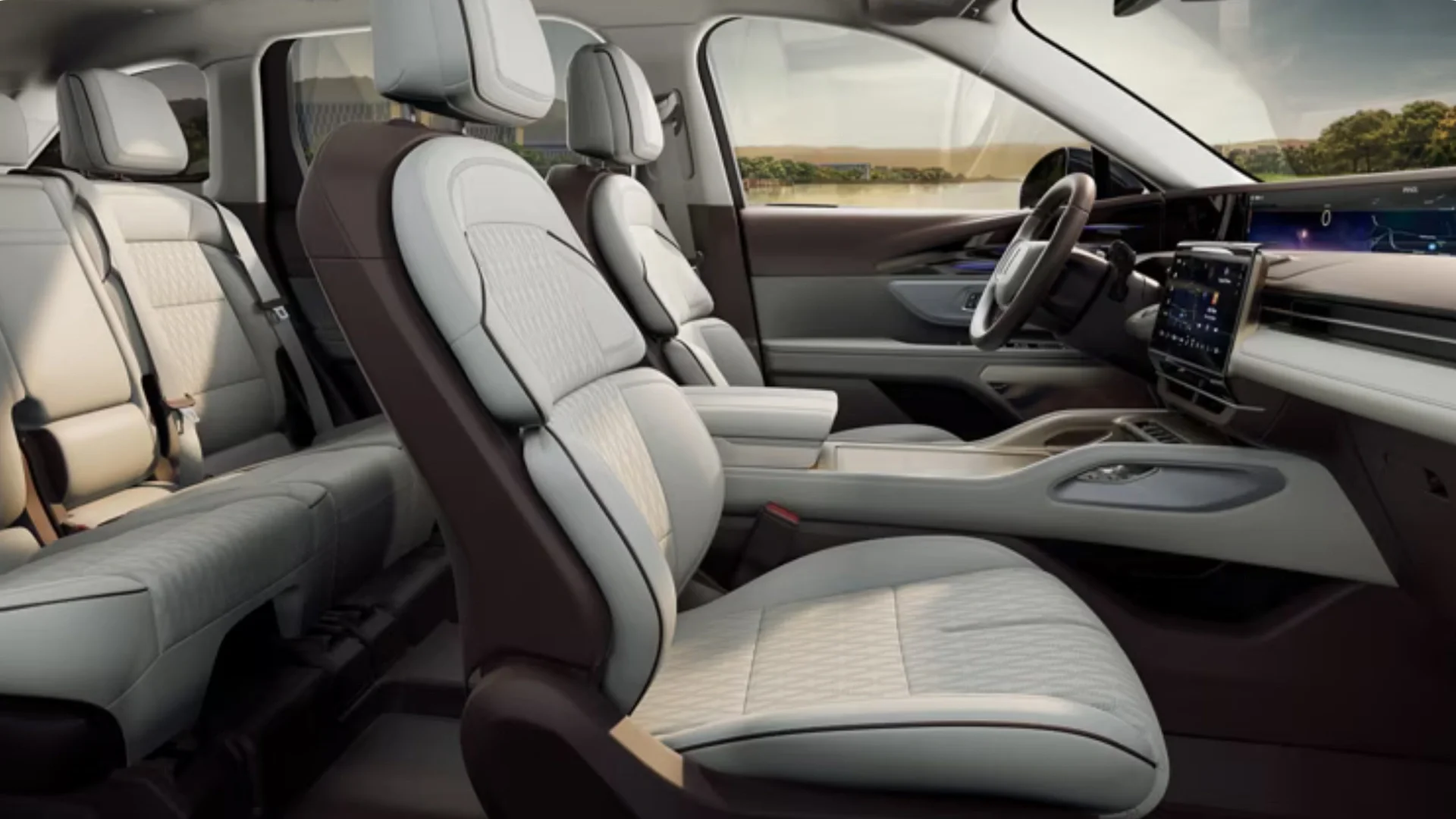 2025 Lincoln Nautilus Black Label interior, two-row leather seats with quilting and contrast piping, panoramic glass roof visible.