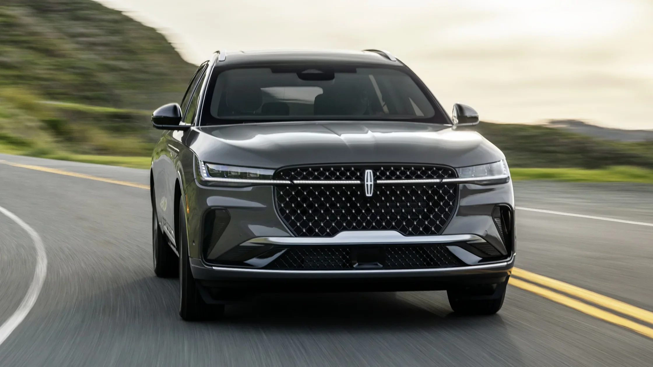 2025 Black Label Nautilus® front view in motion, bold signature grille, sleek LED headlights, and sculpted body.