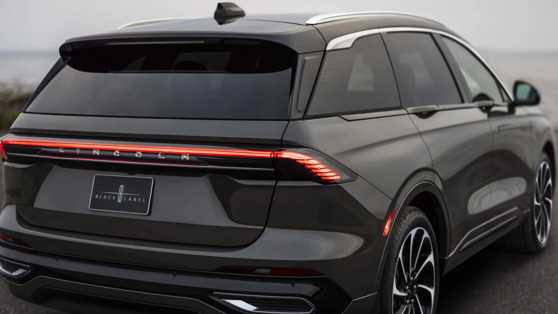 2025 Black Label Nautilus® rear design with LED light bar, dark metallic finish, and sporty roof spoiler.